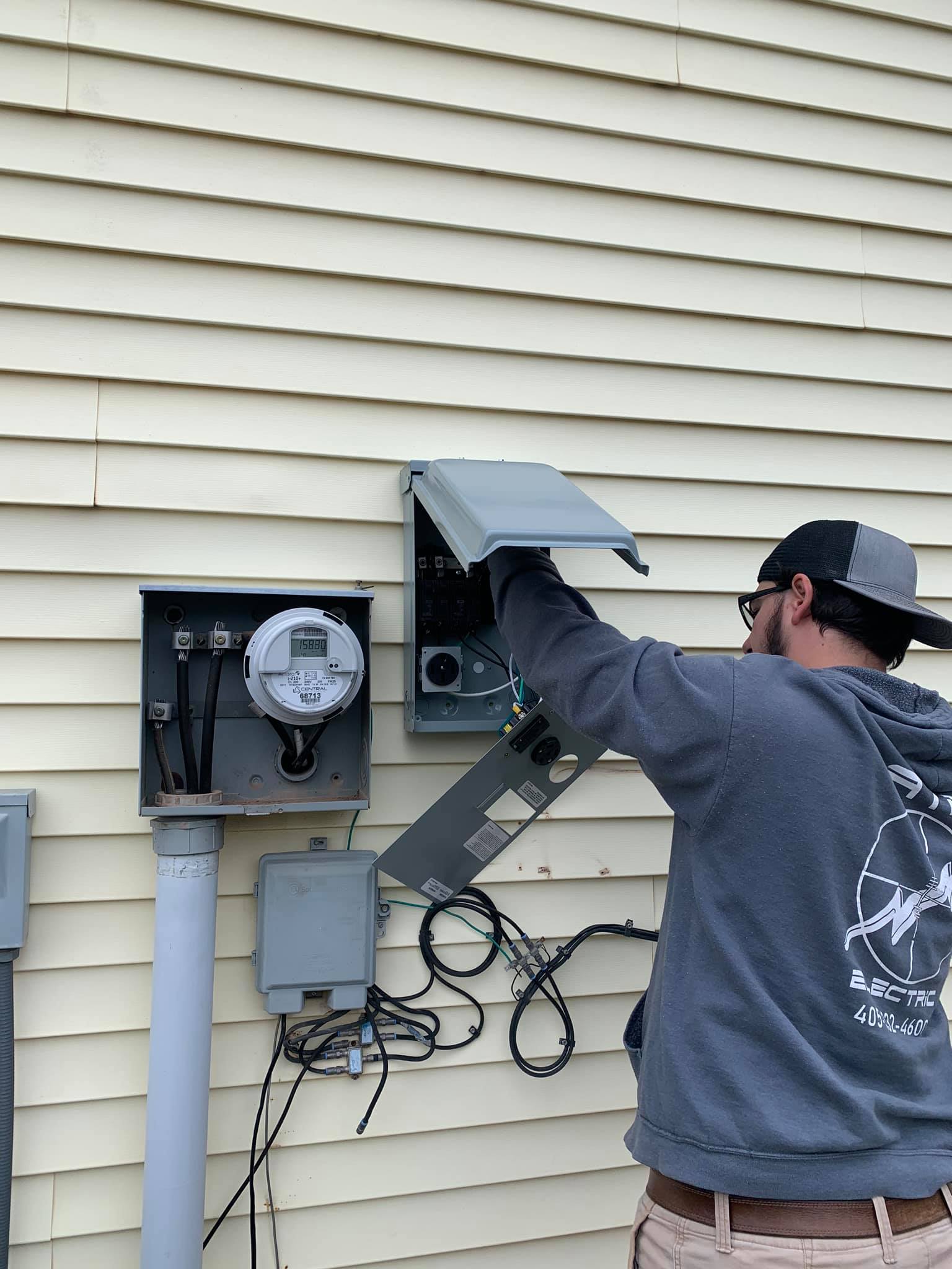 Electrician working on a breaker panel